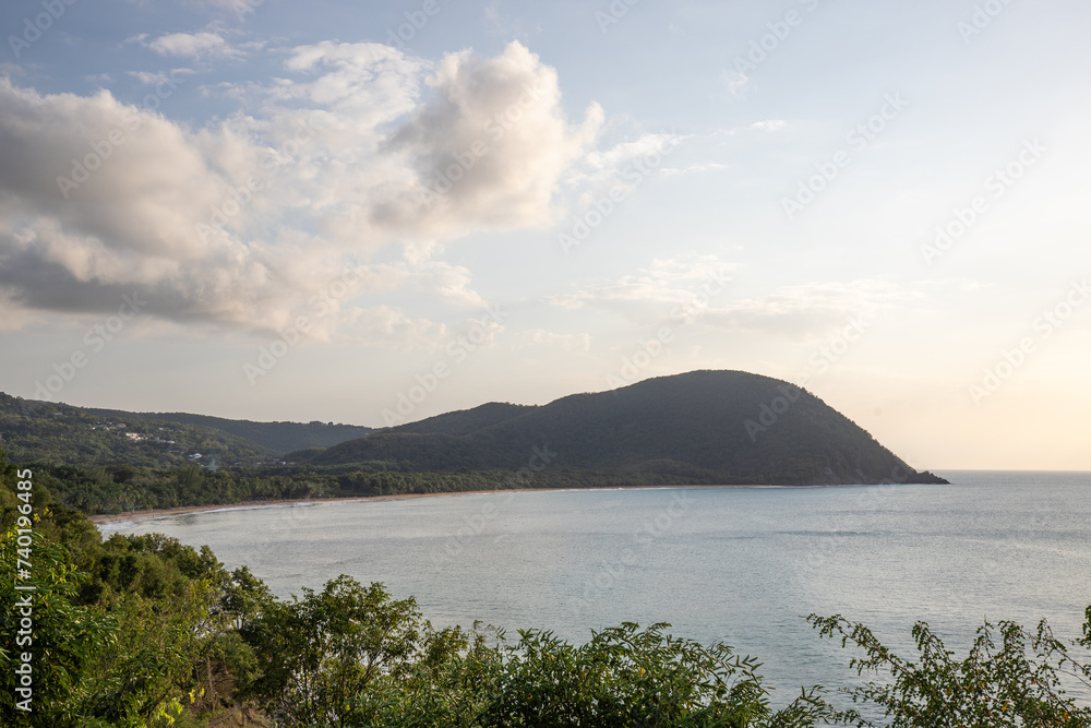 Guadeloupe, a Caribbean island in the French Antilles. Landscape and view of the Grande Anse bay on Basse-Terre. A secluded bay, lots of nature and mangroves, at sunrise.