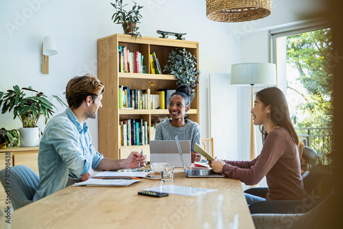 Group of coworkers gathered together at office