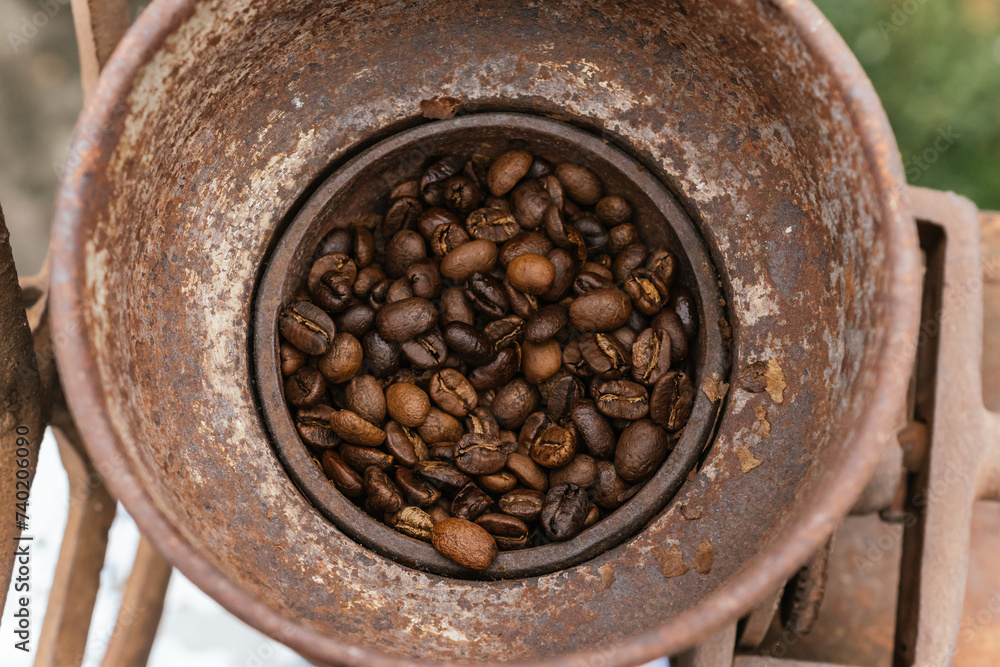 Fototapeta premium Coffee beans ready to be ground in a grinding machine.