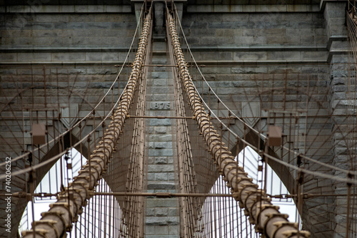 Photo of the central part of the Brooklyn Suspension Bridge linking the boroughs of Manhattan and Brooklyn in New York City (USA), the largest suspension bridge in the world until 1889.