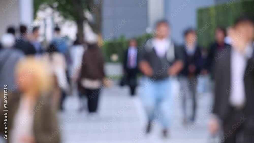 Blurry People Walking on the Sidewalk. Business District. Rush Hour Time. Asian City and Asian People. Blurry Background. Blurry People Walking on the Sidewalk. Business District. Rush Hour Time. Asian City and Asian People. Blurry Background.