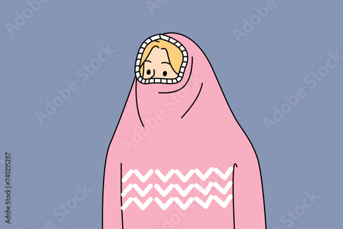 Woman hides face under sweater to keep warm in cold winter weather and not get flu. Shy girl with sweater pulled over head experiences social phobia caused by psychological trauma.