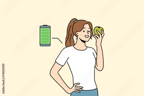Woman eats fresh apple to recharge with energy and vitamins from fruit bought at farmers market. Full battery charge near girl holding apple helping to quickly regain strength during break