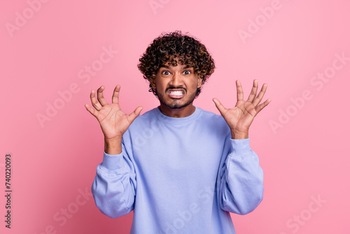 Photo of angry aggressive irritated man wear blue trendy clothes showing hands arms fight conflict isolated on pink color background