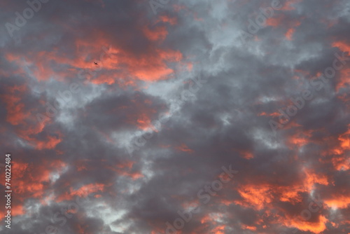 sunset sky with few clouds and pinkish light 