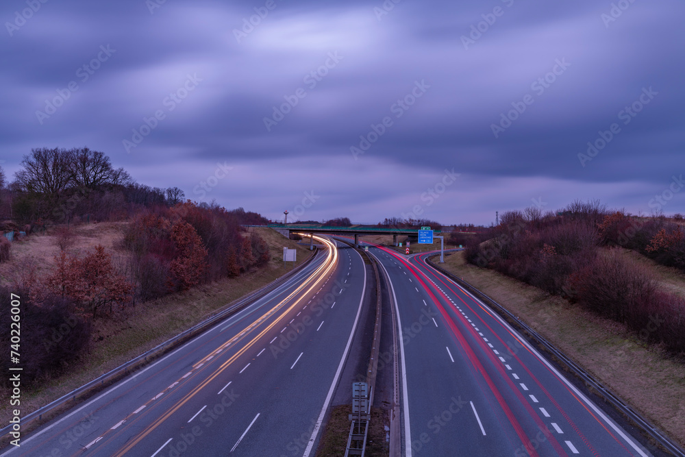 Highway near Krusne mountains with night lines from cars