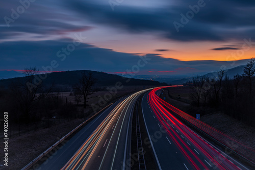 Highway near Krusne mountains with night lines from cars photo