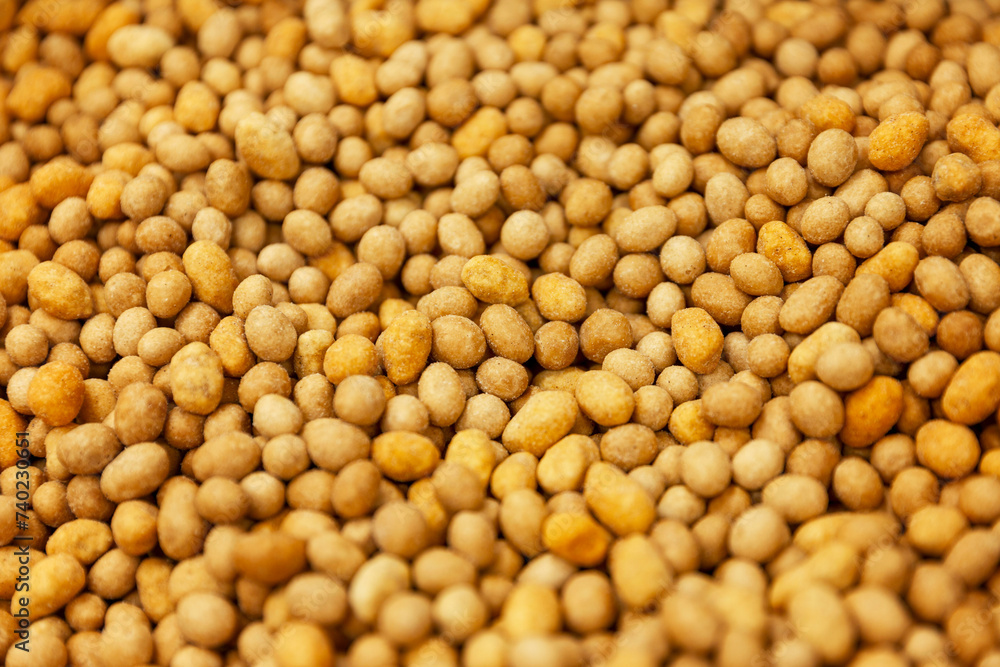 There are a lot of round nuts on the counter. Arretina snack. Close-up. Background. There are a lot of round nuts on the counter. Arretina snack. Close-up. Background.
