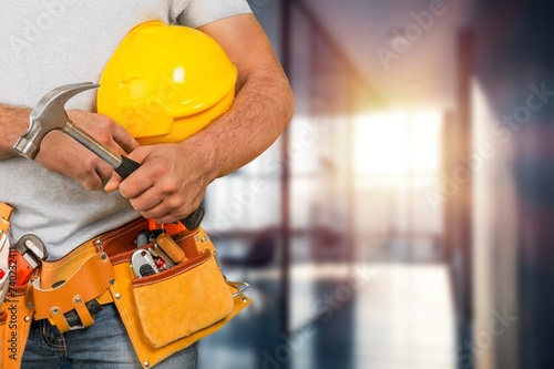 Professional worker with protective equipment at work concept