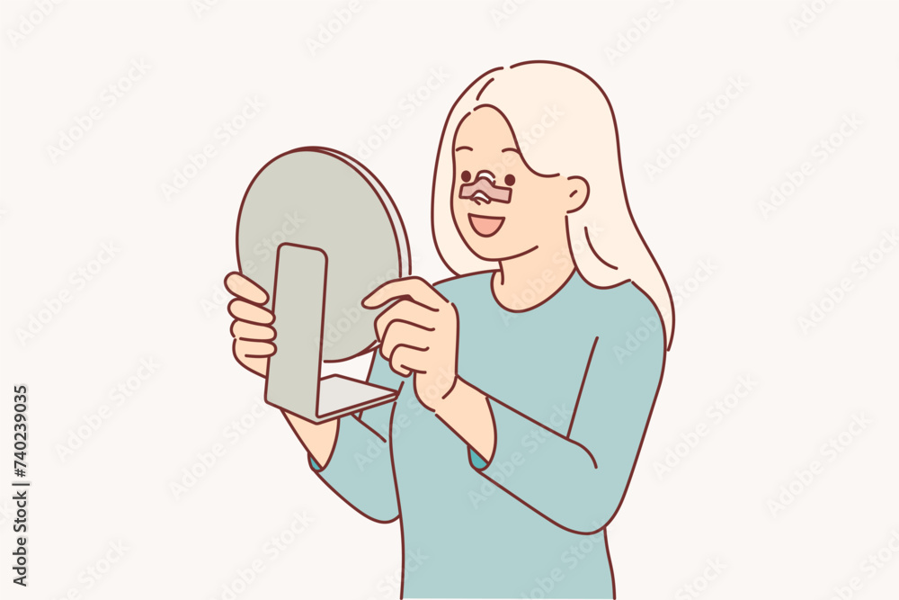 Happy woman after rhinoplasty surgery on nose looks in mirror and rejoices at improvement own image Happy woman after rhinoplasty surgery on nose looks in mirror and rejoices at improvement own image
