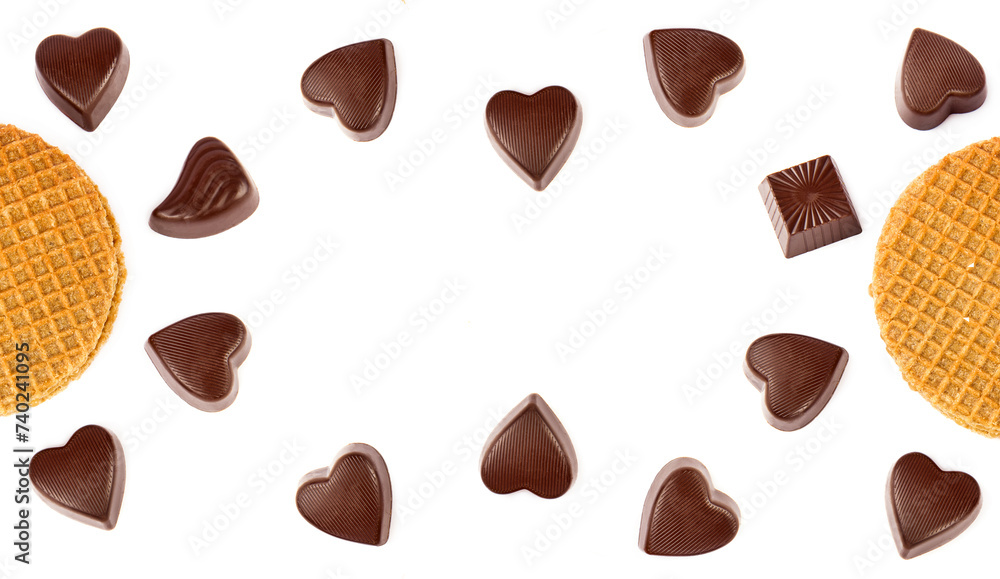 Fototapeta premium Chocolate candies and Belgian waffles isolated on white. There is free space for text. Collage. Wide photo.