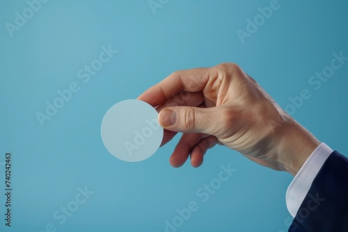 Close up of hands holding blank white business card with copy space.