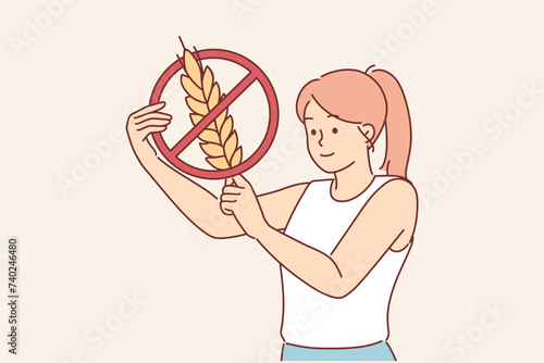 Woman holds gluten-free sign, urging people to stop eating foods containing grains and wheat