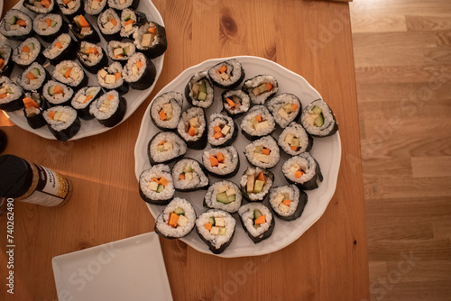 Fresh Homemade Sushi Roll against old wooden table.