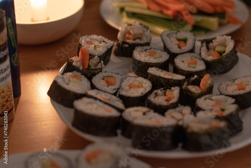 Fresh Homemade Sushi Roll against old wooden table.