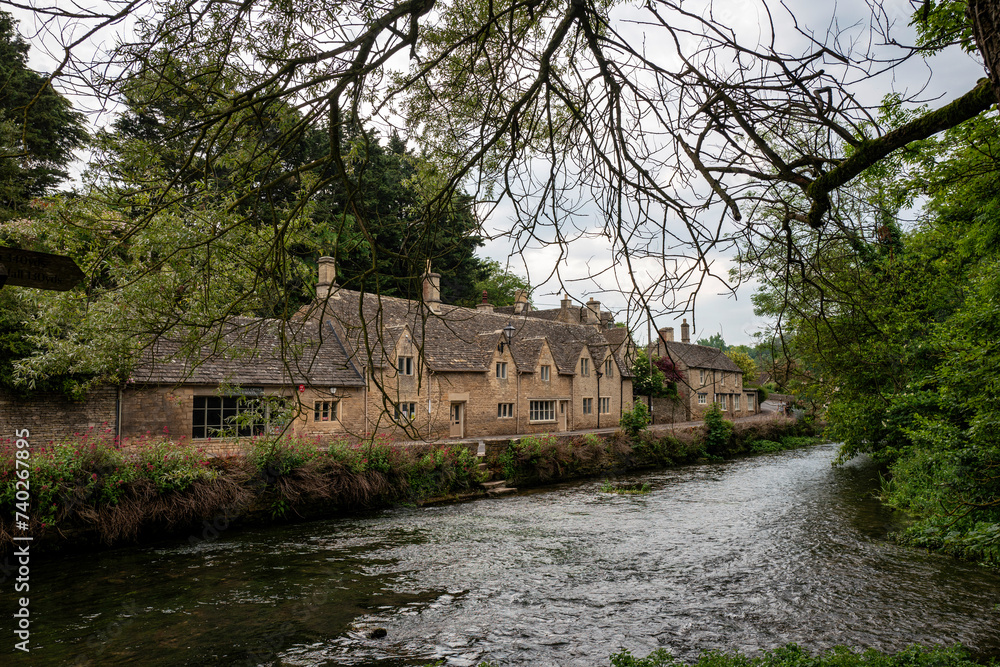 Ancient houses in the English village of Cotswolds, Bibury, England , old house in the village of river