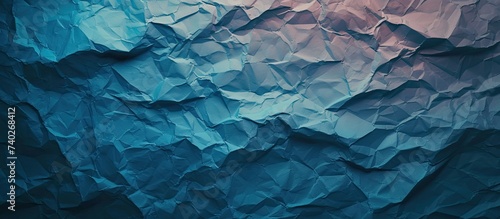 A photo capturing a blue background filled with an extensive quantity of crumpled paper, showcasing textured layers and offering unique design elements.