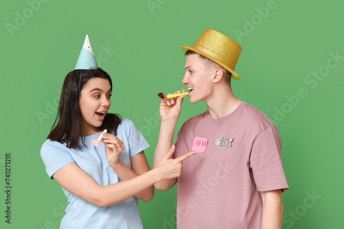 Young couple celebrating pa...