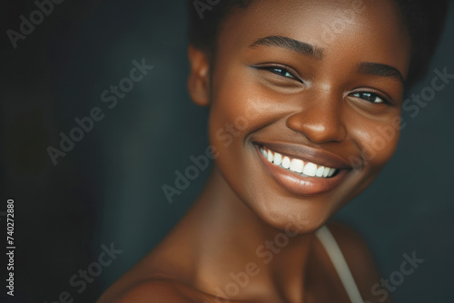 Stock photo of beautiful black woman smiling and having in studio shot.