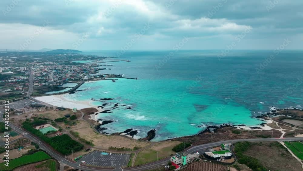 Drone View of Jeju island in South Korea, beach, wind power generators, winter Drone View of Jeju island in South Korea, beach, wind power generators, winter