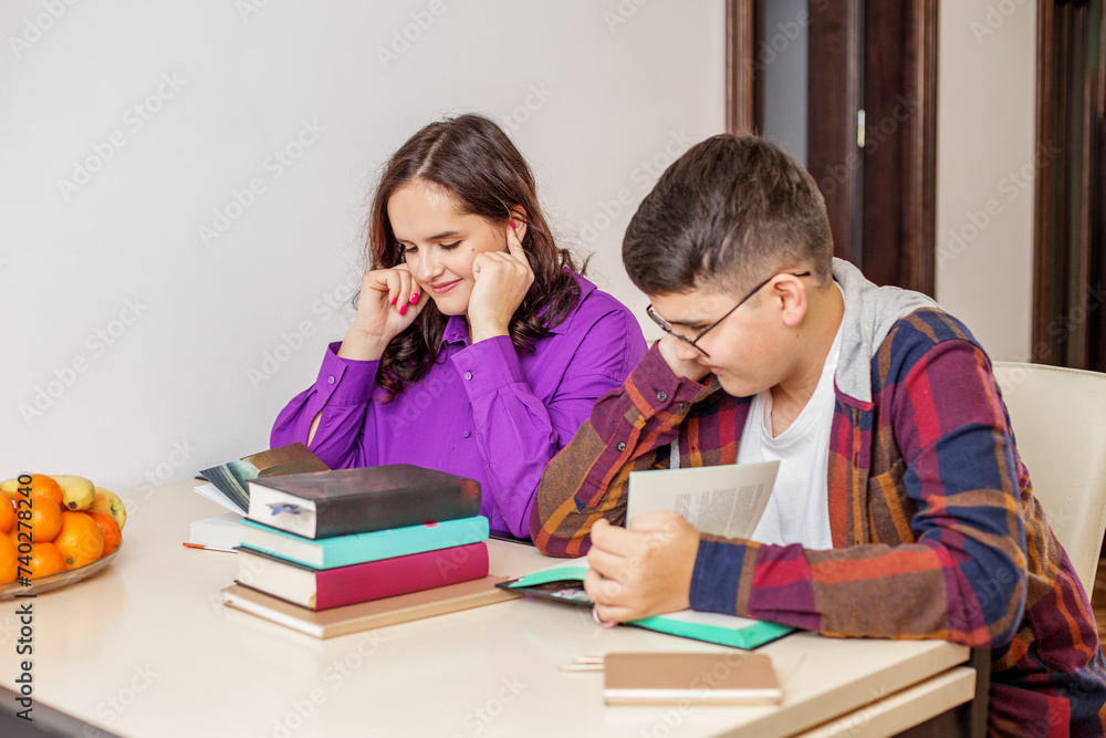 Teenagers Smiling and Studying Together at Home. Gen Z Teenagers Smiling and Studying Together at Home. Gen Z