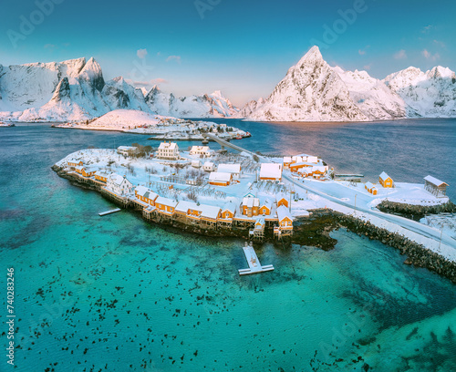 Lofoten islands beautiful nature landscape in Norway and fishing town with scenic yellow rorbu houses of Sakrisoy, Reine