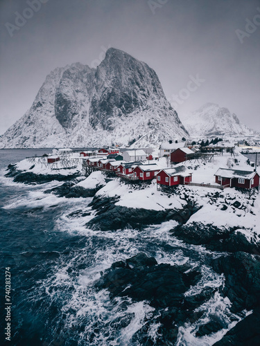 Lofoten Islands, Reine, Norway and Hamnoy fishing village with red rorbuer houses in winter nature panorama landscape