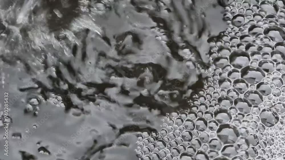 Drops fall on the water. Abstract background. Close-up. Sewage water. Drops fall on the water. Abstract background. Close-up. Sewage water.