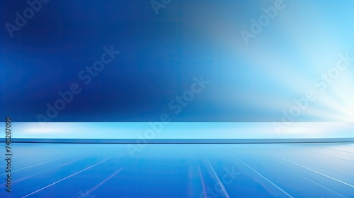 Elegant Blue Gradient Background Illuminated by Soft Spot Light for Product Showcase © StockKing