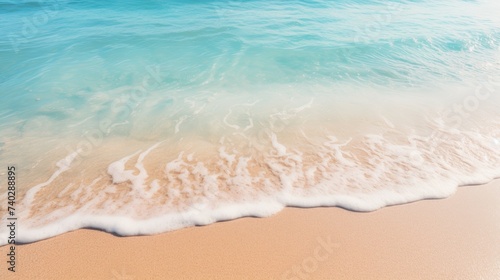 Tranquil Coastal Scene: Soft Wave Caressing Sandy Beach under Clear Summer Sky