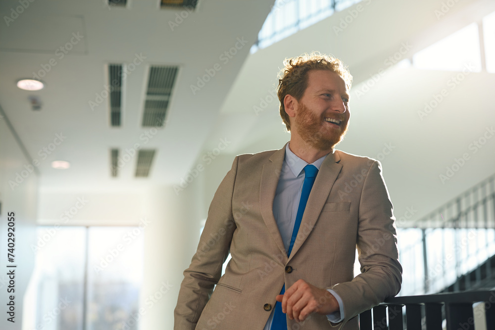 Happy businessman in hallway of office building looking away. Happy businessman in hallway of office building looking away.