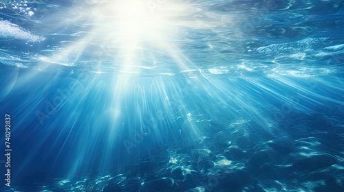 Sublime Light Pierces Through Azure Depths of Serene Ocean Water © StockKing