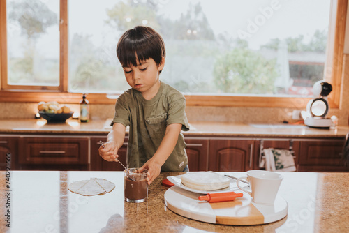 Little child cooking a desert