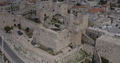 Aerial Footage of the Tower of David, the walls of the Old City and the Old City of Jerusalem.