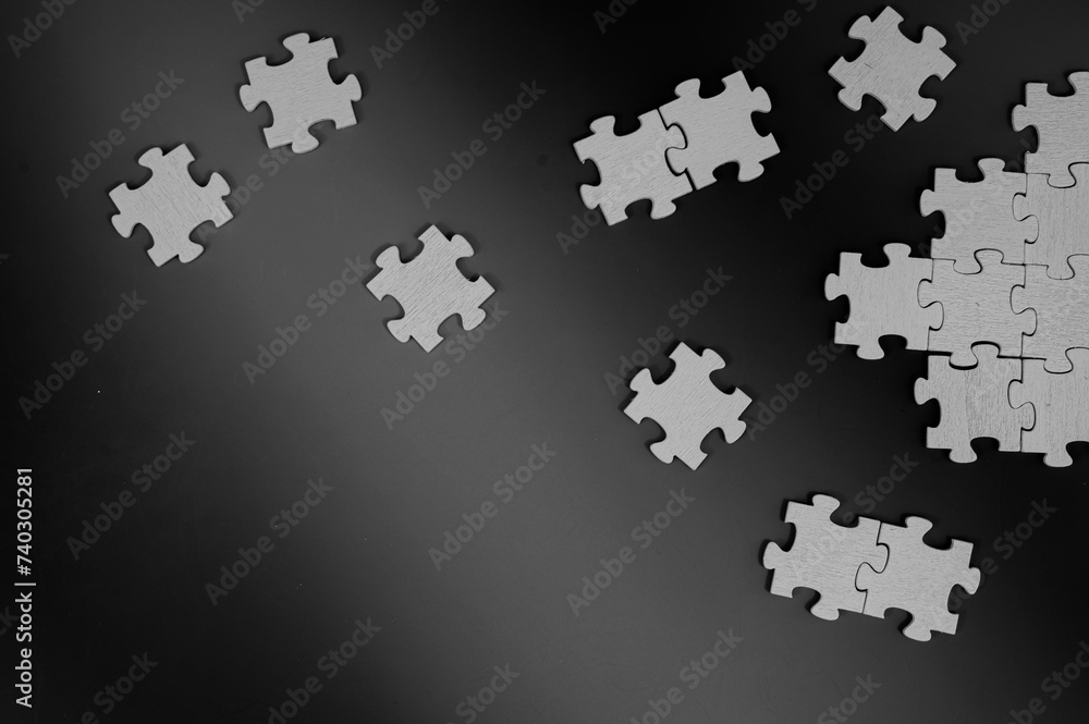 Low key photo background with puzzle pieces Low key photo background with puzzle pieces
