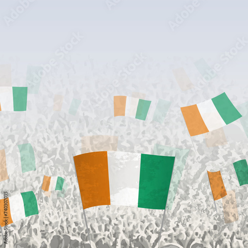 Crowd of people waving flag of Ivory Coast square graphic for social media and news.