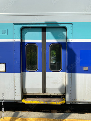 City train at the station ready for departure. Close up of closed doors of a suburban train at the boarding platform.