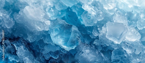Closeup of intricate ice crystals on water surface with blue sky background, creating a mesmerizing winter landscape scene
