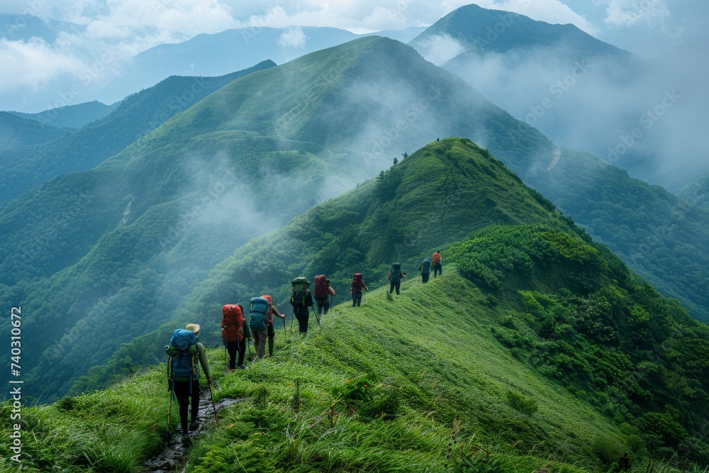 People hiking to the summit of a mountain