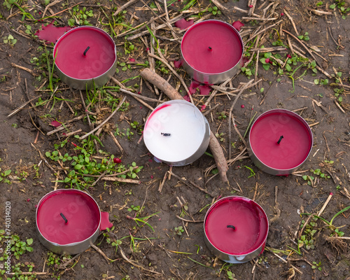 Five Pink Candles and a White One are Placed on the Ground in a Symbolic Ordering. They Have Probably Been Used for a Ritual.