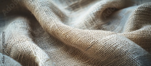 A detailed close up view of a cloth textured with linen on a canvas background.