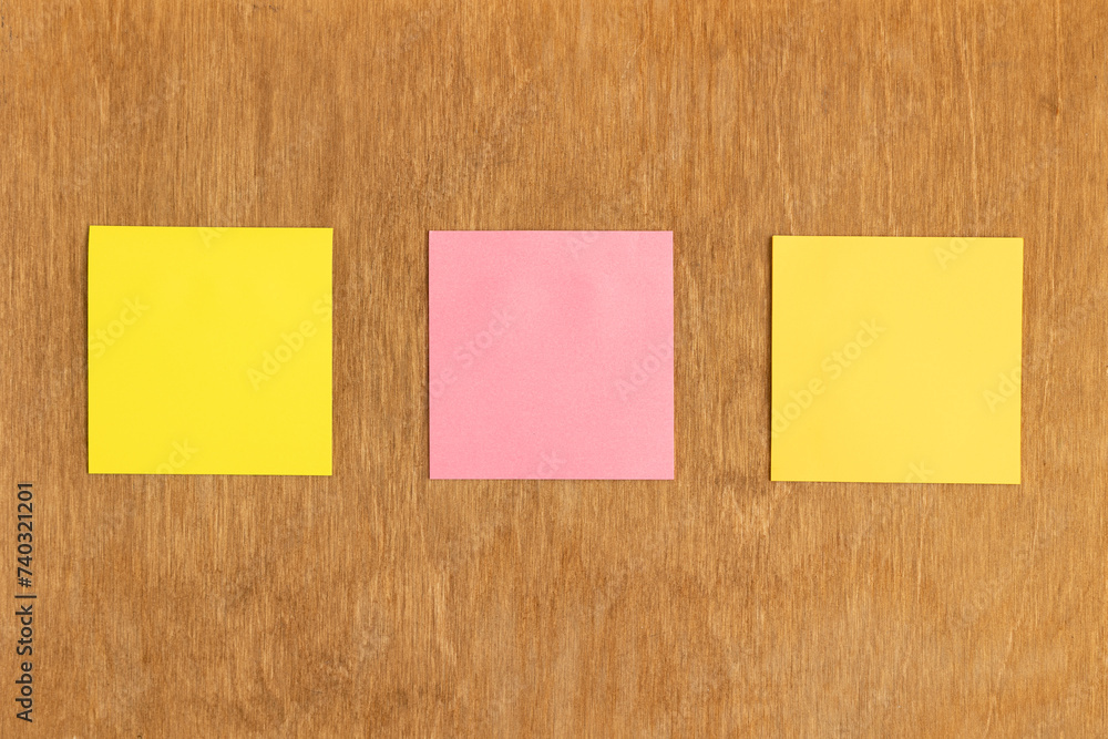 Sticky notes on a wooden wall Sticky notes on a wooden wall