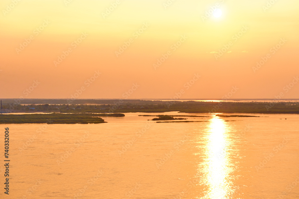 Fototapeta premium Sunset on the Amur river embankment in Khabarovsk, Russia.