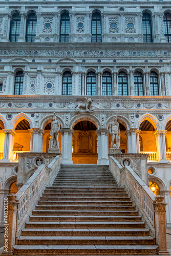 Venice, Italy - February 6, 2024: The Giants Staircase at the Doges Palace, or also known as Palazzo Ducale in the city of Venice, Italy. Statues of Mars and Neptune guard the top of the staircase.