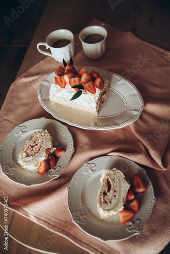 meringue cake combined with fresh strawberries on a background of a pink tablecloth