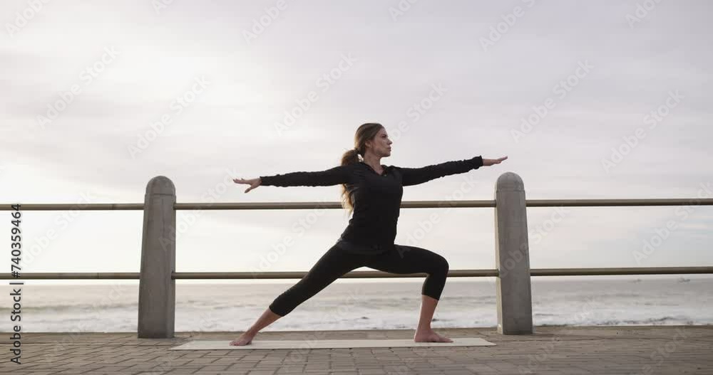 Warrior pose, woman and yoga at beach, fitness and exercise on promenade, zen and mindfulness. Female person, meditation and spiritual awareness at ocean, balance and stretching for wellness at sea Warrior pose, woman and yoga at beach, fitness and exercise on promenade, zen and mindfulness. Female person, meditation and spiritual awareness at ocean, balance and stretching for wellness at sea