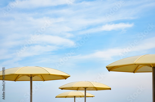 Photography Yellow sun shade umbrellas with blue sky at Toronto HTO Park