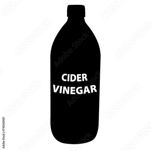 A bottle of cider vinegar in silhouette