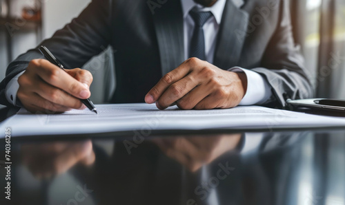 A businessman wearing suit ...