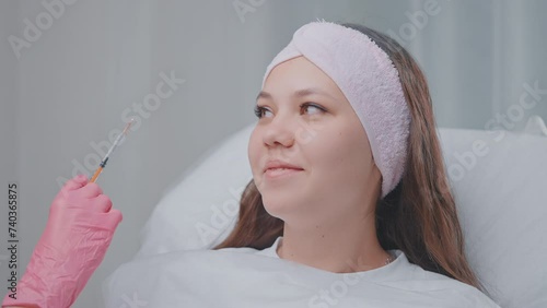 consultation with cosmetologist, portrait of young woman in beauty clinic, botox injections